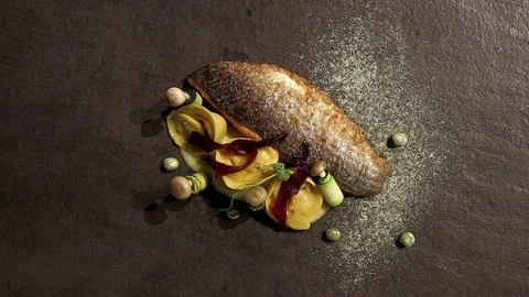 Chief cook decorating dish in restaurant. Video stock 74480865