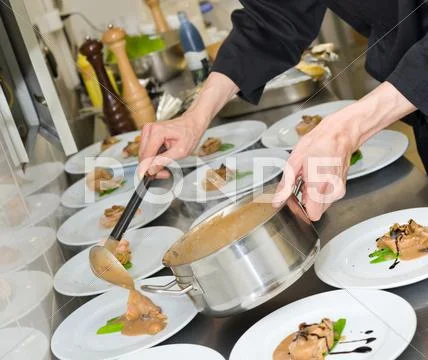 Chief cook at work Stock Photos