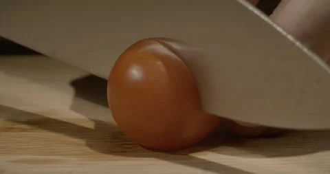 Chief cutting cherry tomatoes on wood board, 4k Vidéo 249245812