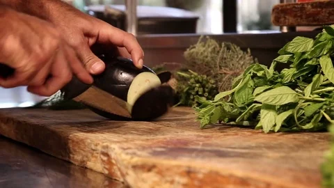 Chief cutting an eggplant. Stock Footage 74481044