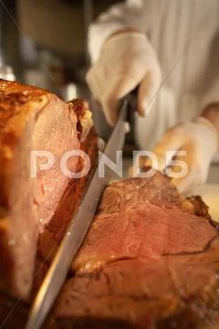 Chief cutting lamb Stock Photos