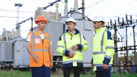 Chief engineer and specialists learning the report of investment for power plant Stock Footage 194618583