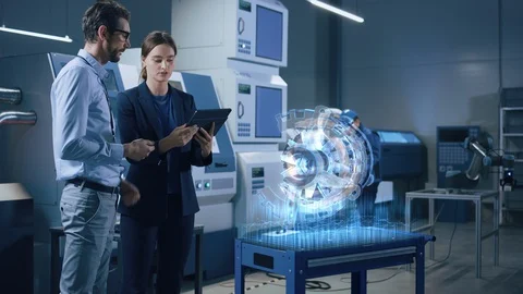 Chief Engineer Holds Tablet Computer, Shows AR Model of an Electric Generator Stock Footage 128854573