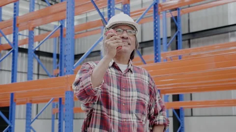 Chief Engineer inspect the construction work in the factory. Stock Footage 154592993