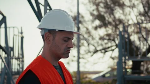 Chief engineer with an interested look outdoors Stock Footage 331514081