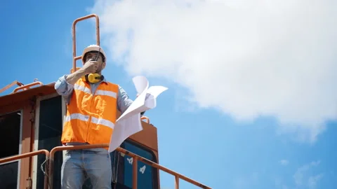 Chief engineer Or construction worker is ordering construction work in factory.  Video stock 138386083