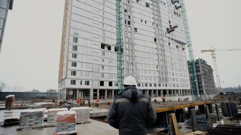The chief engineer oversees the progress of construction Stock Footage 302779200