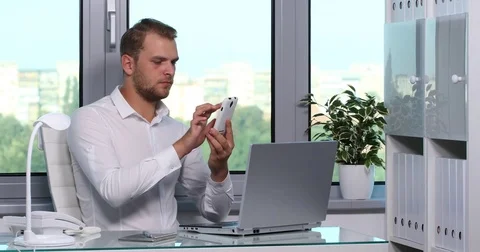 Chief Executive Officer Using a Mobile Phone Happy Social Networking Office Room Stock Footage 69872276
