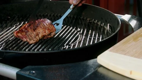 Chief fry meat on a pan Stock Footage 139520162