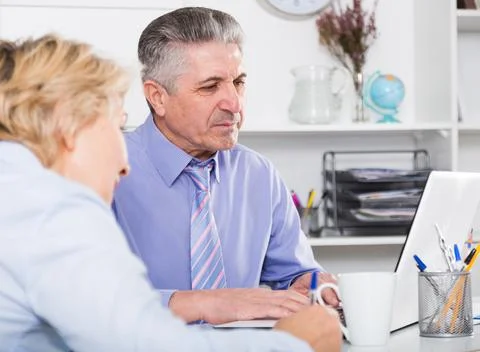 Chief gives task to assistant Stock Photos