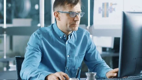Chief Industrial Engineer Working on Personal Computer in the Stylish Room. Stock Footage