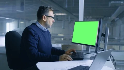 Chief Male Engineer Working on Technical Project on His Person Computer. Stock Footage 77536271