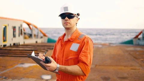 Chief officer on deck of ship or vessel with checklist Stock Footage 108640421