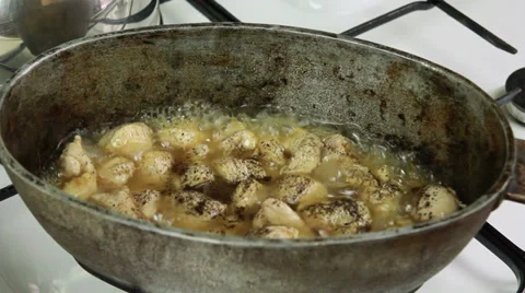 Chief peppering simmering meat in kettle Stock Footage 32594580