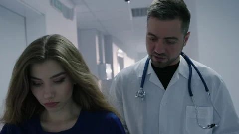 The chief physician explains to colleagues how to treat the patient Stock Footage 208000286