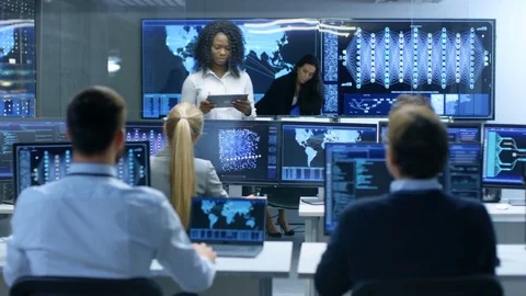 Chief Project Engineer Consults Tablet Computer and Holds Briefing for a Team. Stock Footage 81273135
