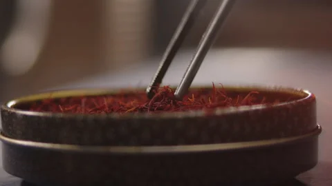 Chief taking saffron to cook some gastronomic food Stock Footage 172073579