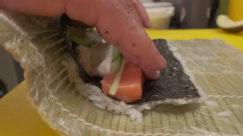 Chief is wrapping rolls with a mat Stock Footage 237852609