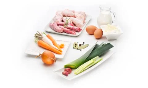 Chiken meat for broth with various ingredients isolated on white background Stock Photos