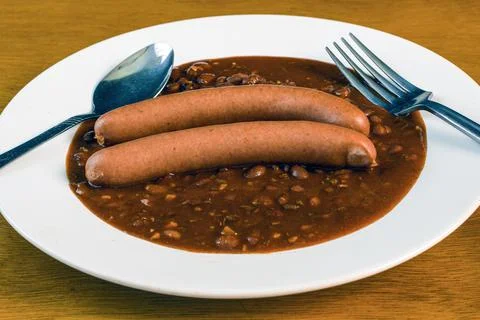 Chil on a plate wit two hot dogs Stock Photos