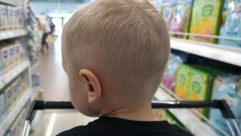Child 3-5 years old with blond hair and black T-shirt 스톡 동영상 296339334