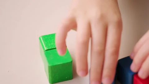 Child 5 years old stacking blocks, Building castles, playing educational wo.. Stock Footage 330423609