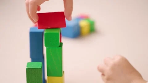 Child 5 years old stacking blocks, Building castles, playing educational wo.. Stock Footage 335084809
