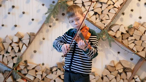 Child of 7 years playing the violin Stock Footage 85665978