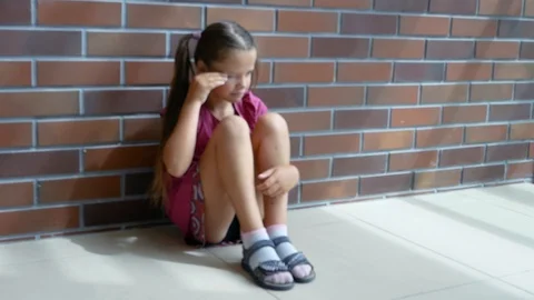 Child abuse. Little girl crying, sitting... | Stock Video | Pond5 