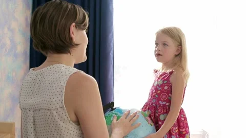 The child admires the globe of the world Stock Footage 157883318