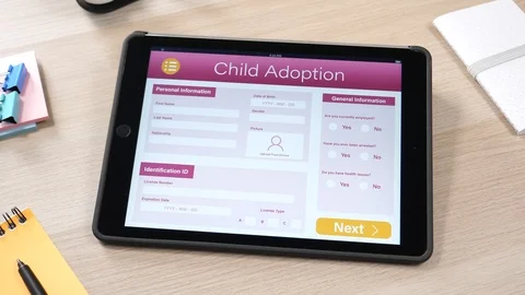 Child Adoption Online Application Form On a Tablet PC Touch Screen Stock Footage 89762821