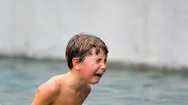 Child In Agony After Having Been Physically Hurt At The Pool. Young Boy Cries Stock Footage