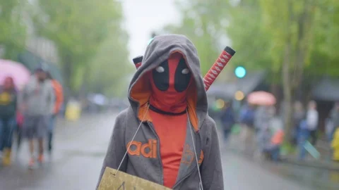 Child in alien costume with message during annual McMenamins' UFO Festival Stock Footage 87803836