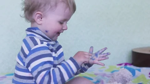 The child is all in felt-tip pens. Creativity, drawing, hobby, imagination, play Stock Footage 193635741
