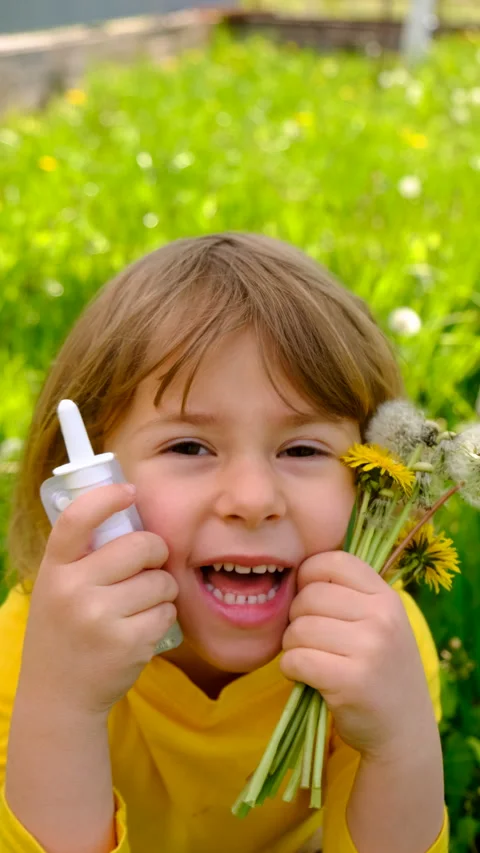 The child is allergic to dandelions. Selective focus. Stock Footage 309921227