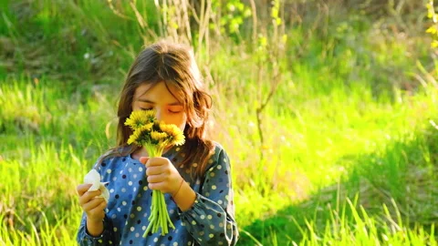 The child is allergic to flowers. Selective focus. Stock Footage 154394157
