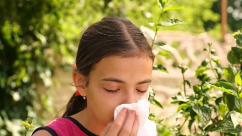 The child is allergic to flowers. Selective focus. Stock Footage 244778415