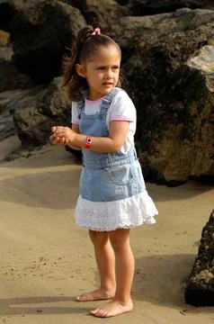 Child alone on beach Stock Photos