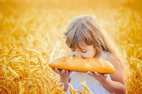 Child and bread. selective focus. food and drink. Stock Photos