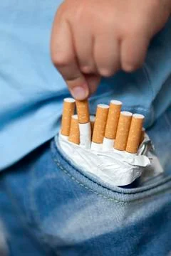Child and cigarette Stock Photos