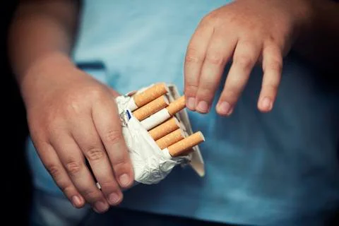 Child and cigarette Stock Photos