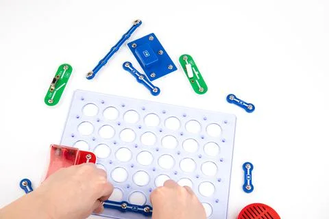 Child and electronic constructor isolated on white background Stock Photos