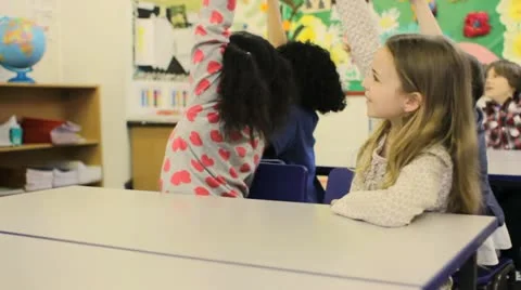 Child answering a question in school Stock Footage 22663885
