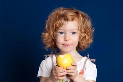Child with apple Stock Photos