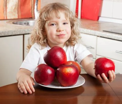 Child with apple Stock Photos