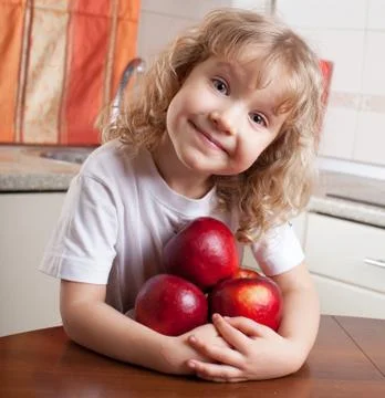 Child with apple Stock Photos
