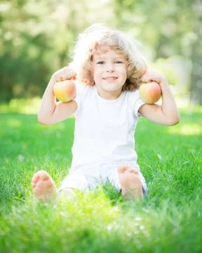 Child with apples Stock Photos