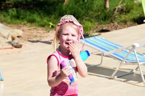 Child applying sunscreen Stock Photos