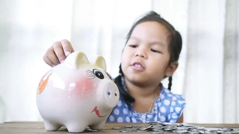 Child asian little girl putting coin Stock Video Pond5