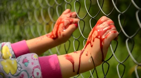 Child asks for help in blood. Violence against children. Child in the blood of t Stock Footage 40273280